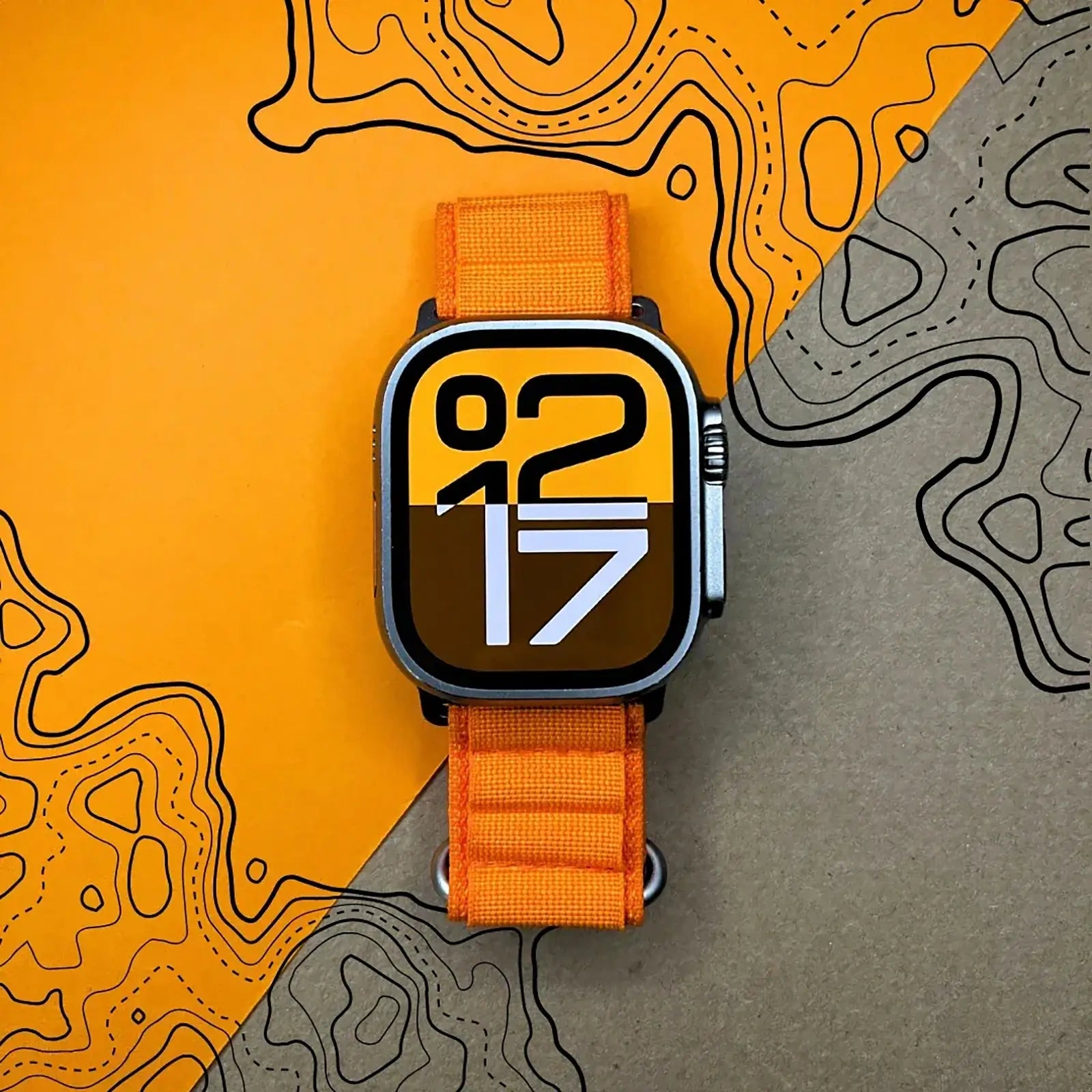 Smartwatch with an orange strap on a background with abstract designs