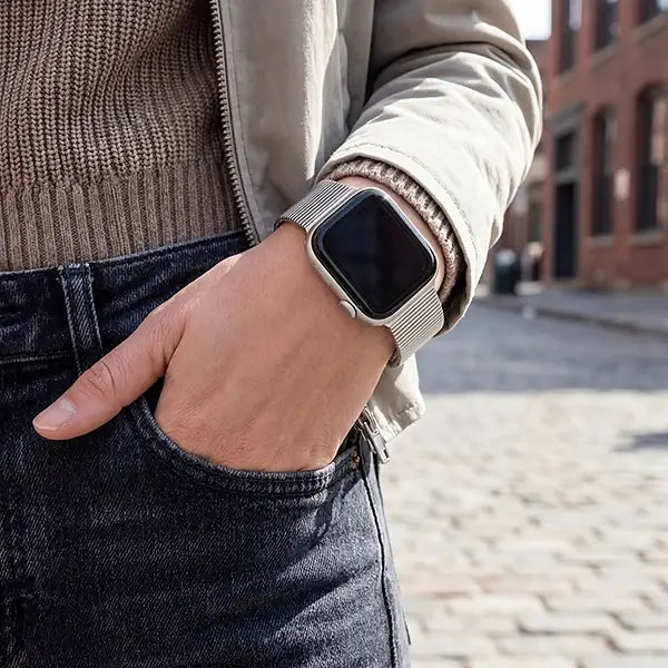 Person wearing a smartwatch on an urban street