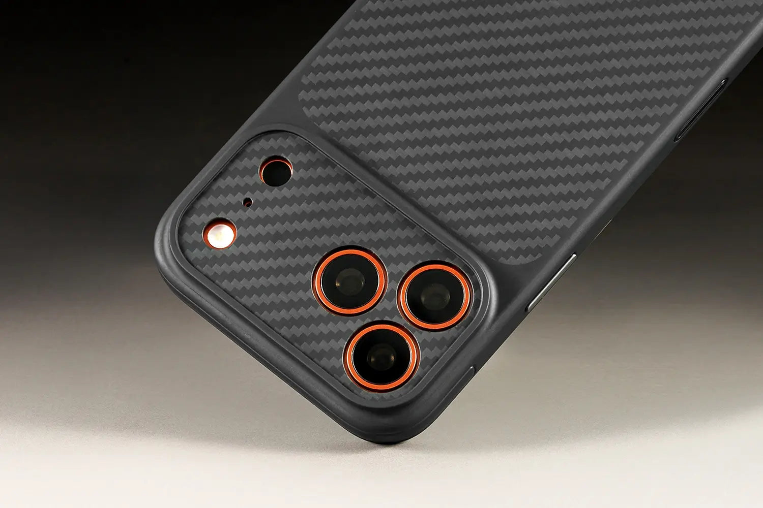 Black phone case with carbon fiber texture on a dark background