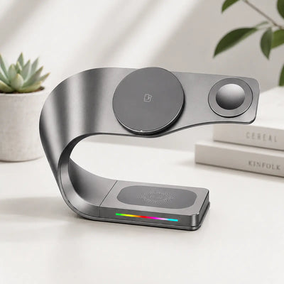 Modern wireless charging device on a white surface with a plant and books in the background