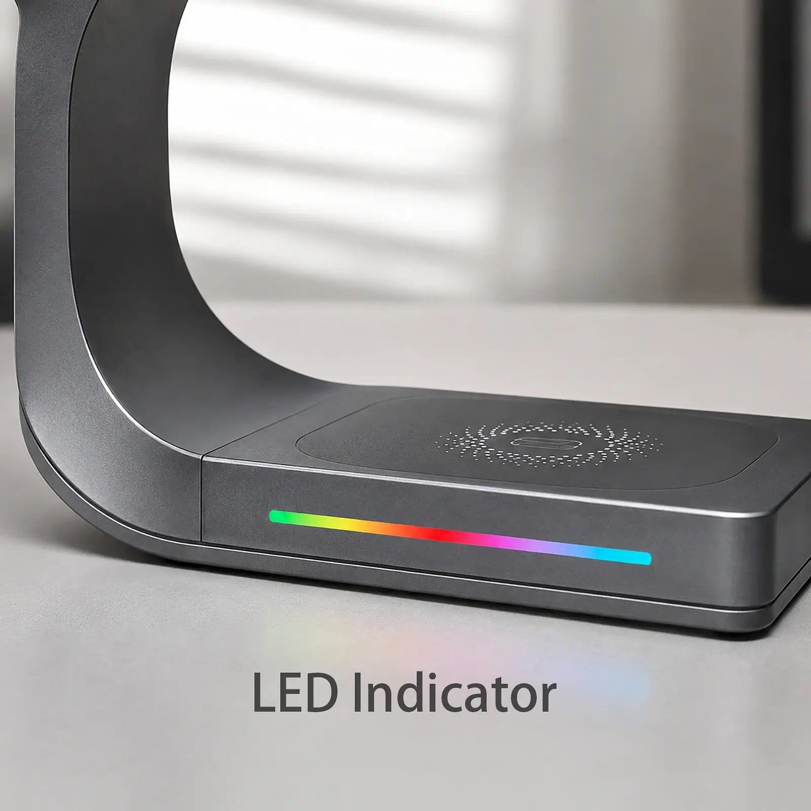 Gray electronic device with LED indicator on a light surface
