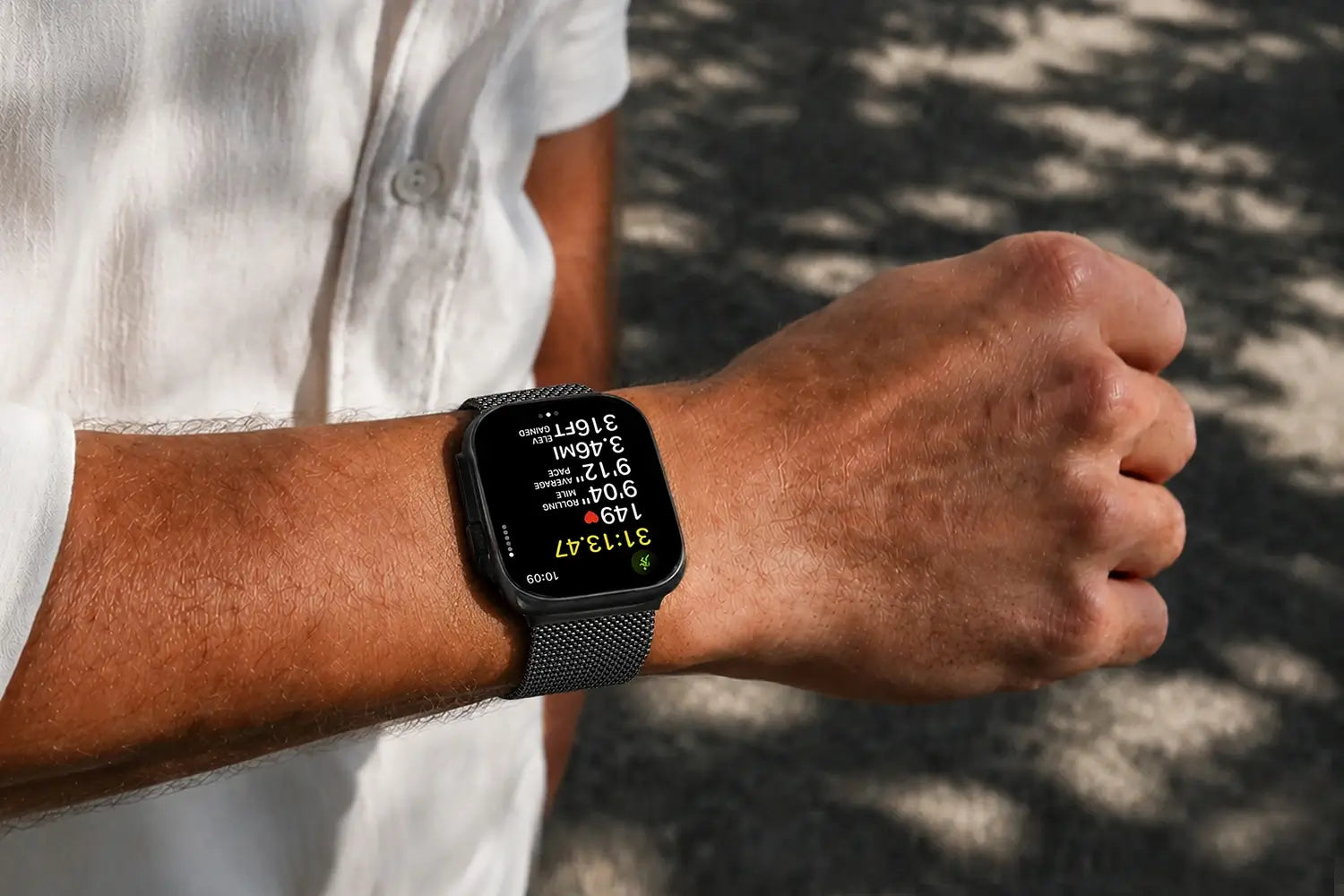 Person wearing a smartwatch on their wrist with a blurred background
