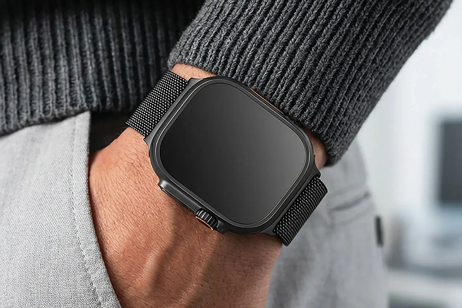 Black smartwatch on a person's wrist with a blurred background