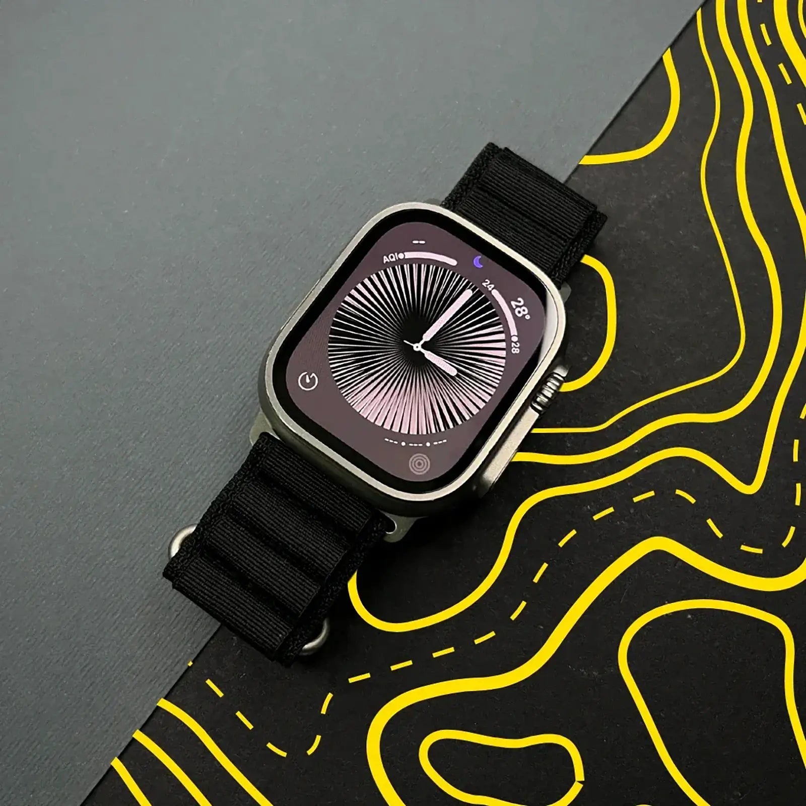 Smartwatch with a black strap on a topographic map background