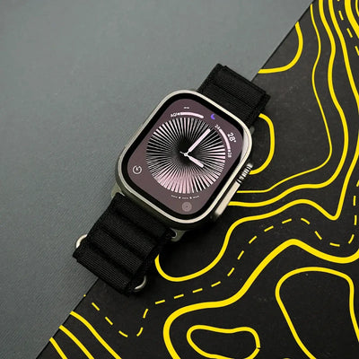 Smartwatch with a black strap on a topographic map background