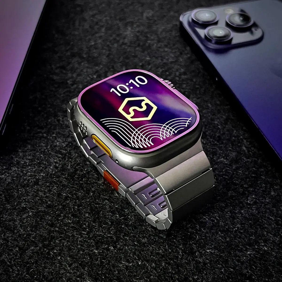 Smartwatch with a colorful display on a dark textured surface