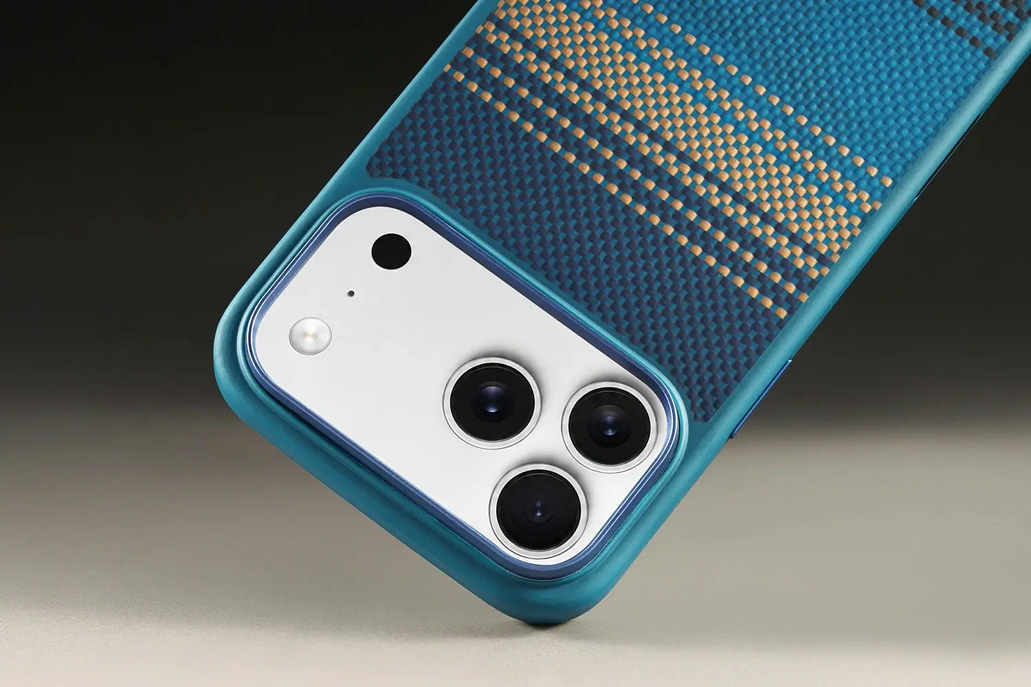 Blue phone case with textured pattern on a neutral background
