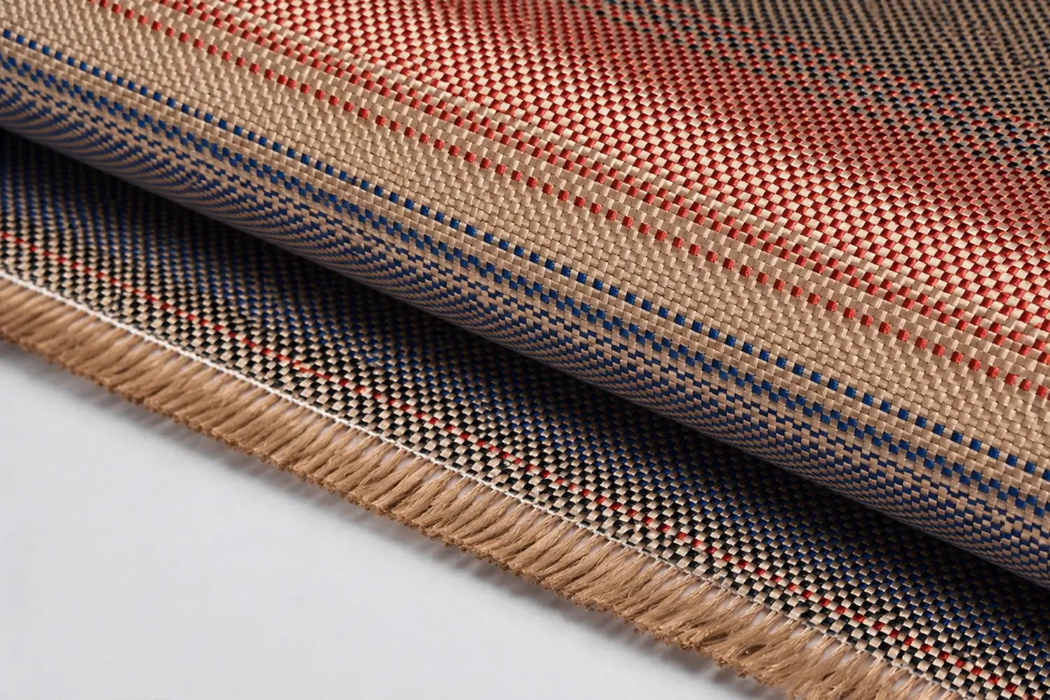 Close-up of woven fabric with a plaid pattern on a white background